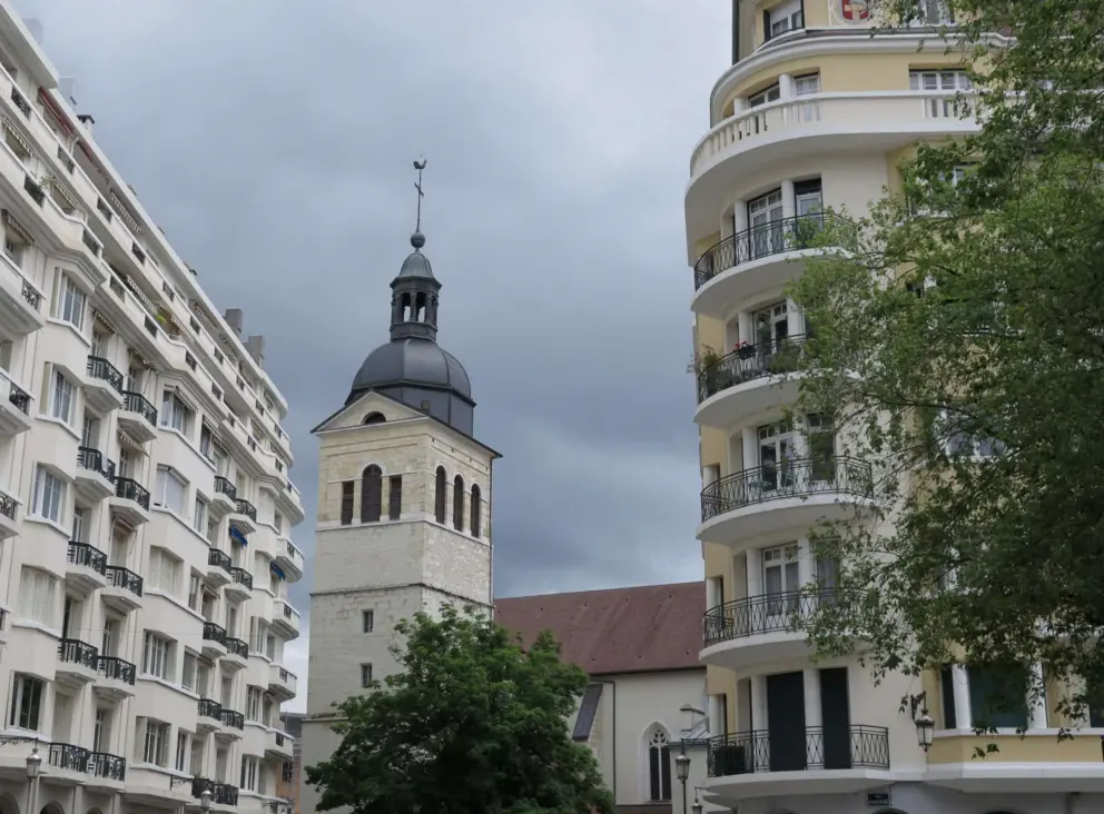 The tower of Eglise Saint Maurice, and apartment buildings. 