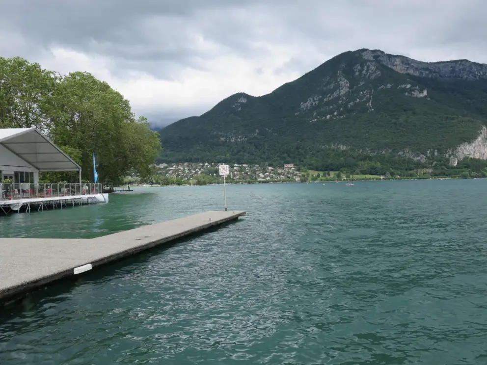 Views of the mountains and of Le Pop Plage, a popup beach cafe, from the dock at Plage de l'Imperial. 