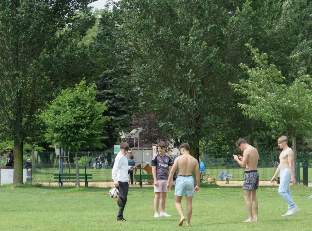 Boys play soccer (football) at Parc Charles Bosson. 