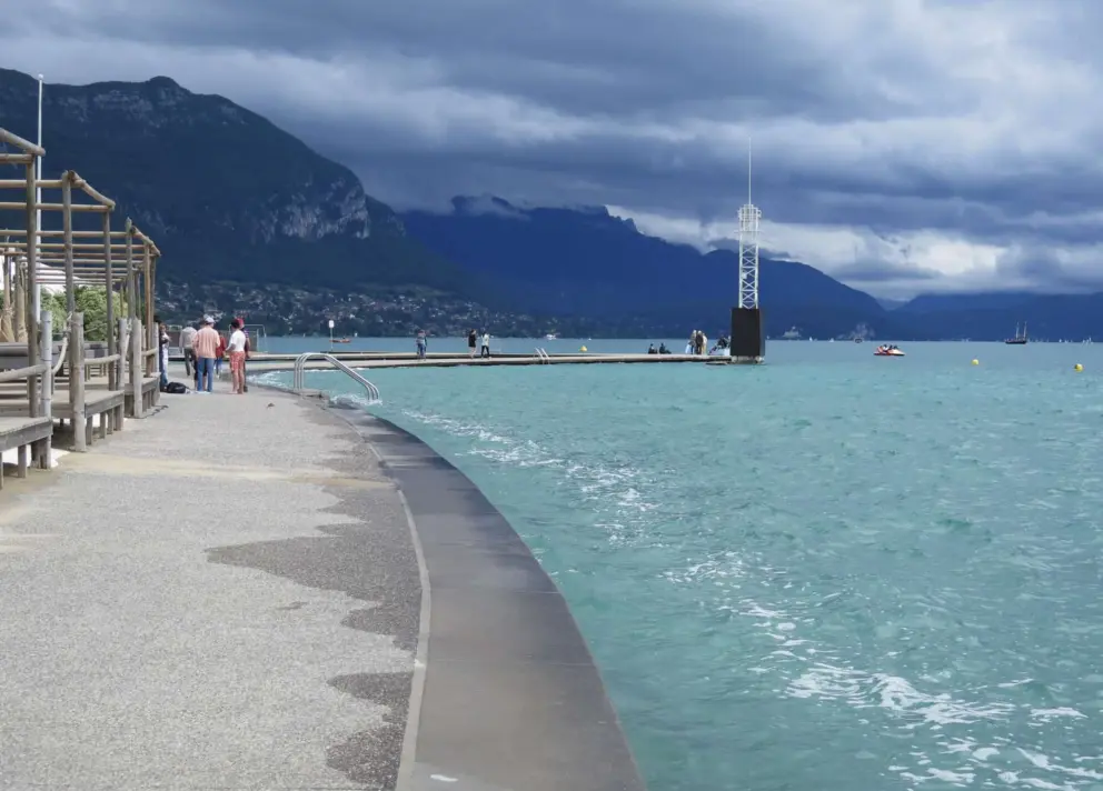 Water splashes along the shore at Plage de l'Imperial. 