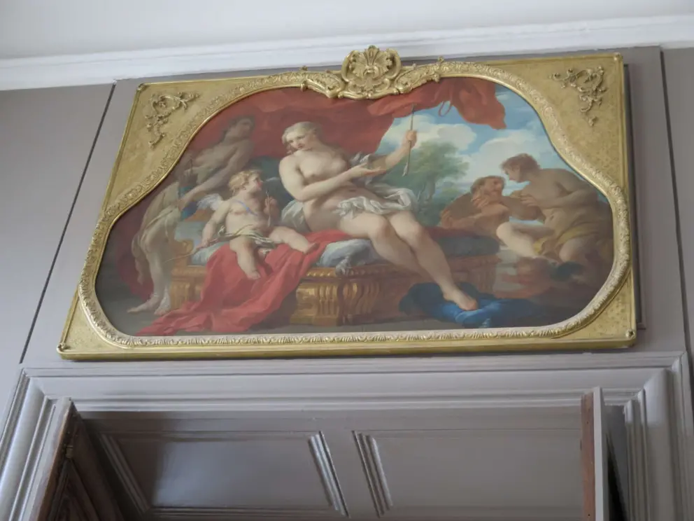 Painting above a doorway in the mansion.