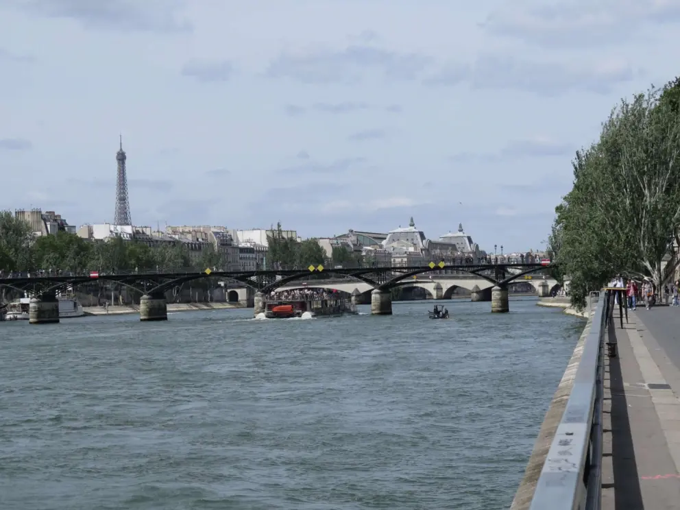 Pont des Arts, with its metal architecture, and the Eiffel Tower behind. 