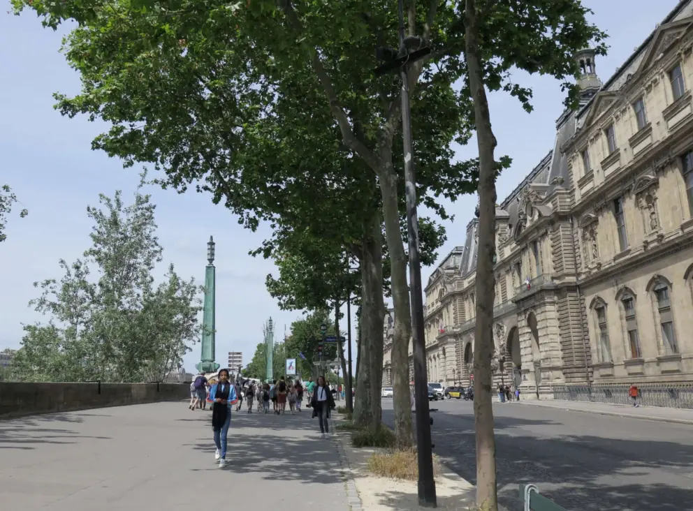 The upper walkway along the street, high above the promenade. 