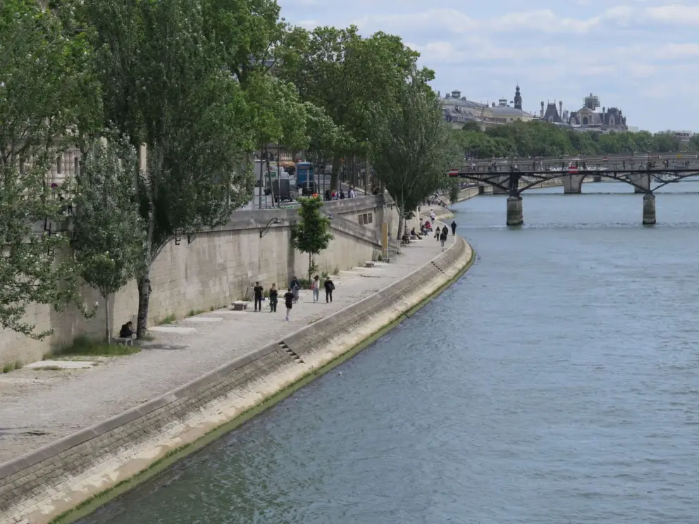 The promenade is at river level, below the street level. 