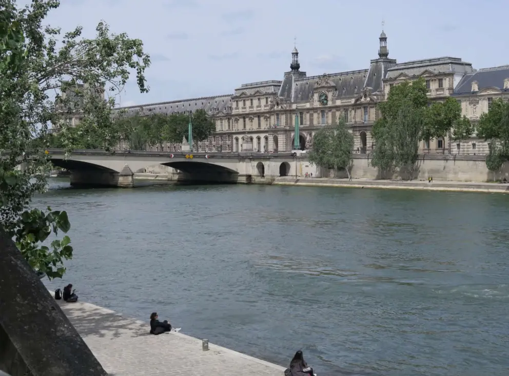 Sitting on the banks of the Seine. 