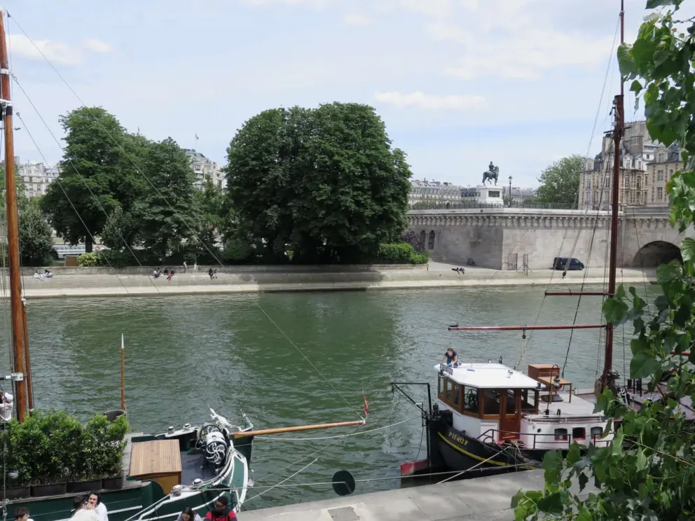 View of Square Vert-Galant on Ile de la Cite, from Quai de Conti. 