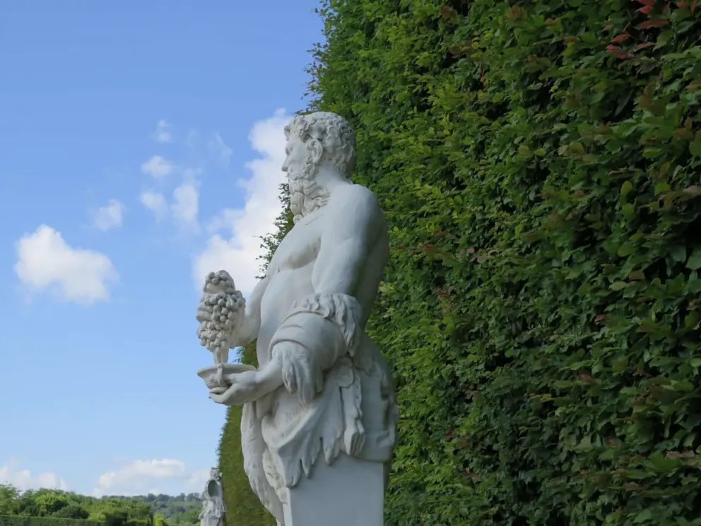 Faune sculpture and blue sky. 