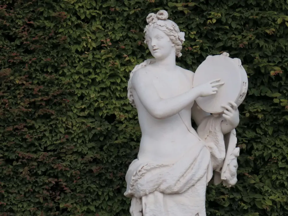 Sculpture of woman with a tambourine. 