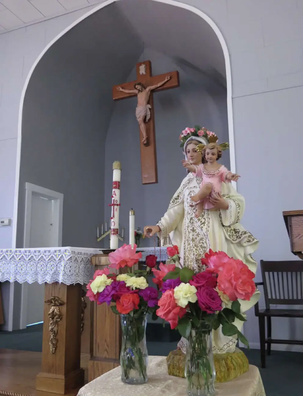 Mary and baby Jesus sculpture near the altar, inside Santa Margarita de Cortona Catholic Church. 