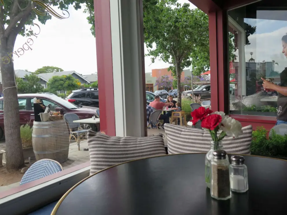 The cozy window seating inside Cafe Madeleine. 