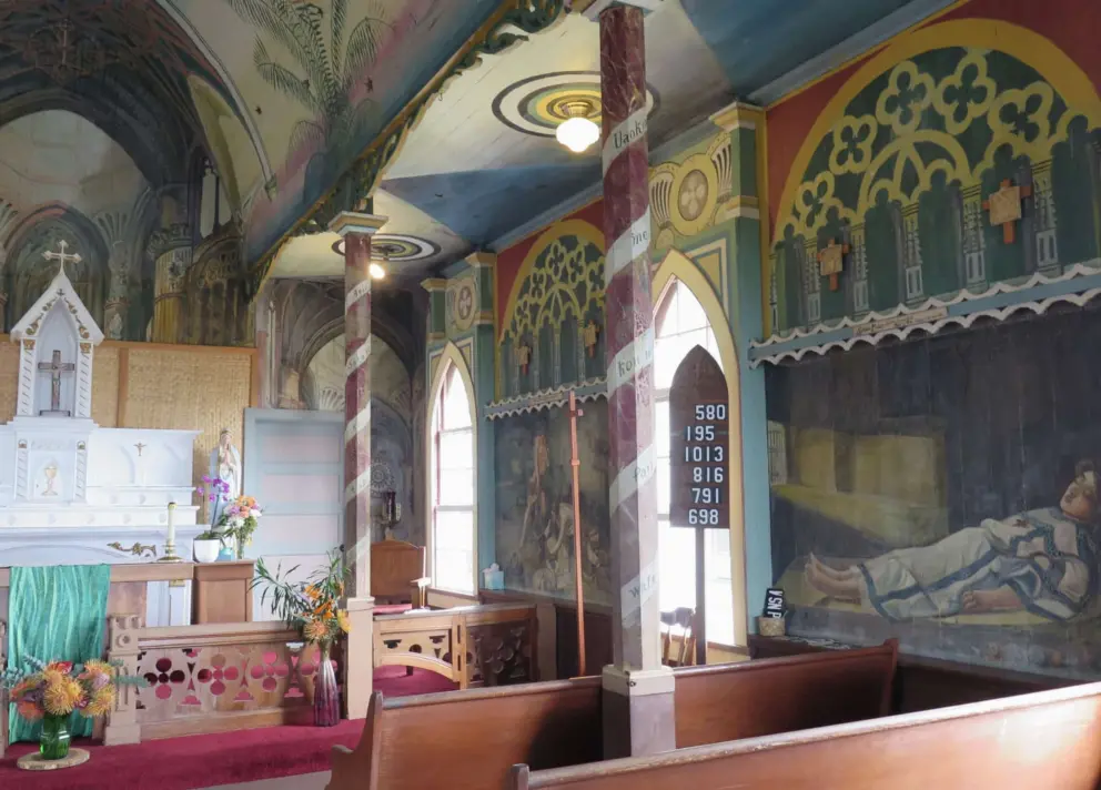 There are six paintings inside the church, three on each side. 