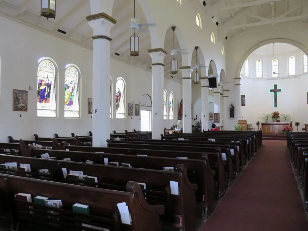 The stained glass windows along the side of the church. 