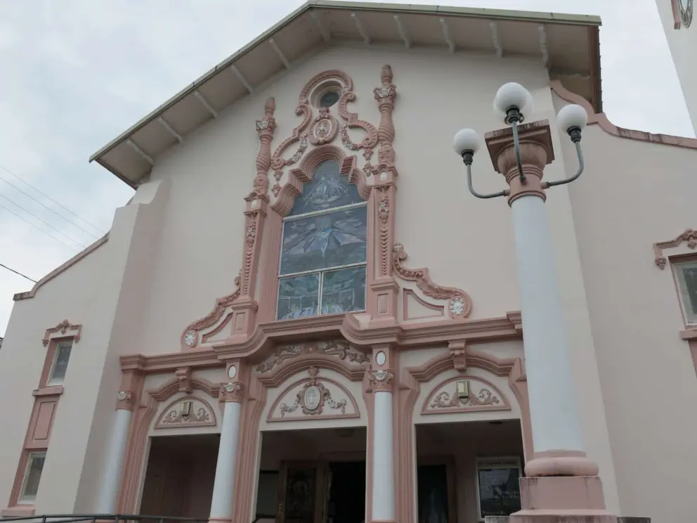 The pink and white exterior of the church is beautiful, as is the vintage lampposts. 