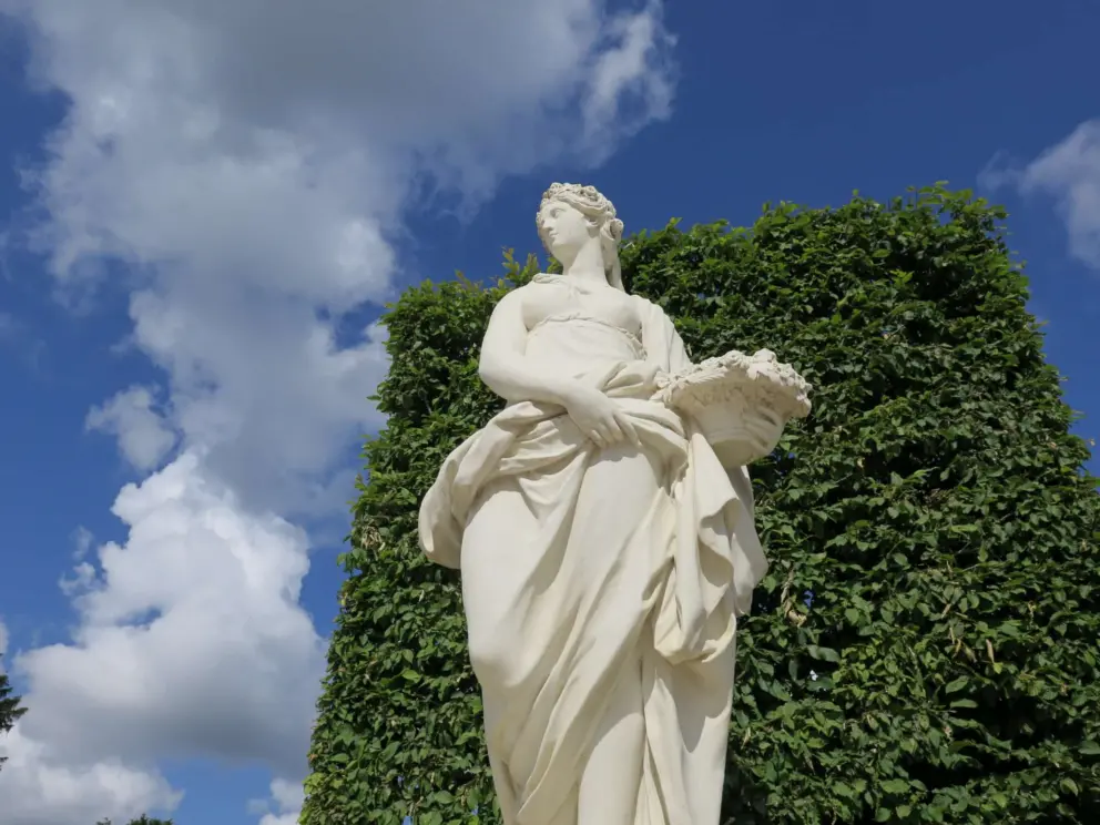 Sculpture of a goddess with a basket called Le Printemps, or Spring.  