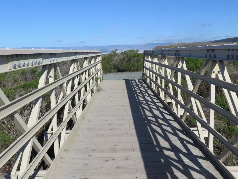 You cross over a pedestrian bridge. 