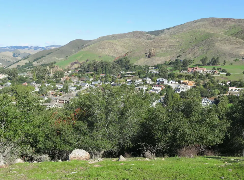 Views of the town and green hills. 