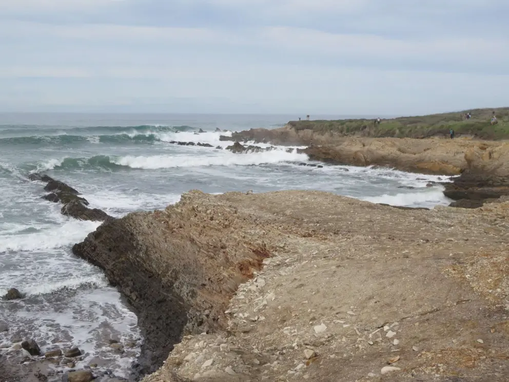Crashing waves by a headland on the south end of the trail. 