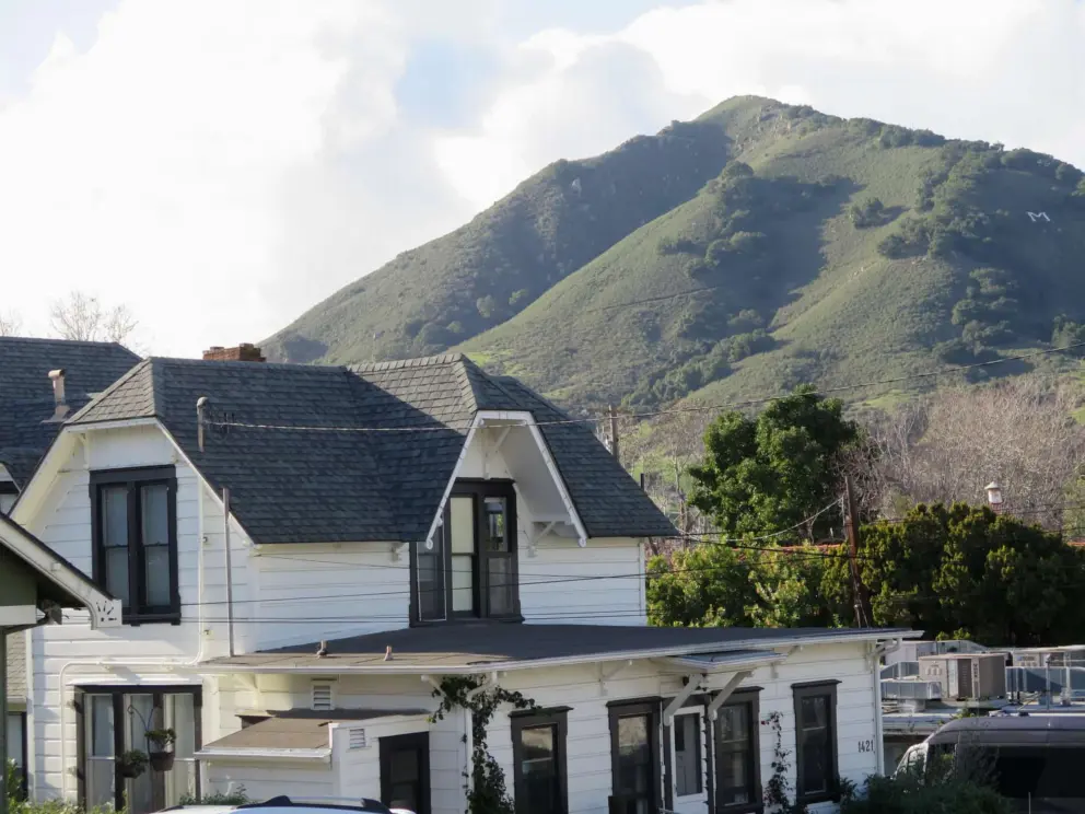 Cerro San Luis looks beautiful behind historic houses.