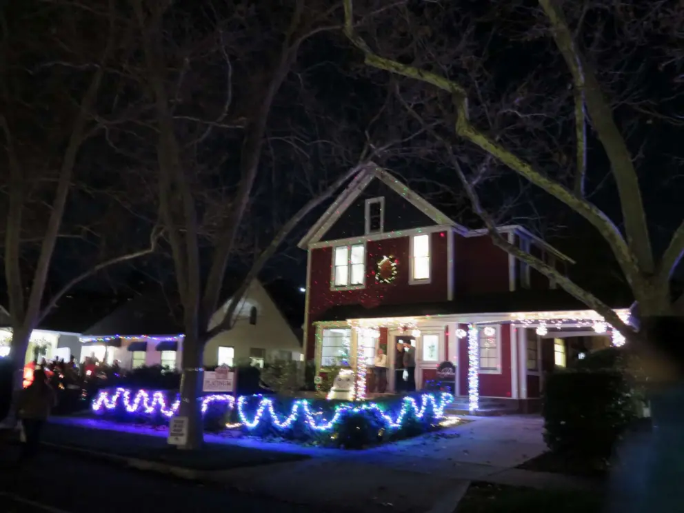 An elegant house under tall trees on Vine Street. 