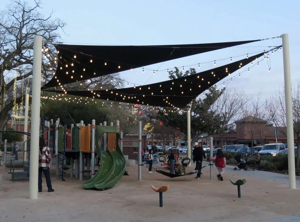 The playground at Downtown City Park in December at night.