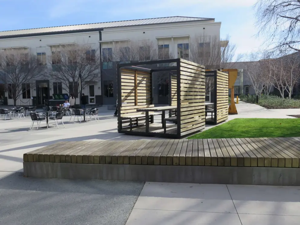 Wooden cabana in the sunny square on the Classic campus. The grey squares on the ground spell "hack" and can be seen from satellites.