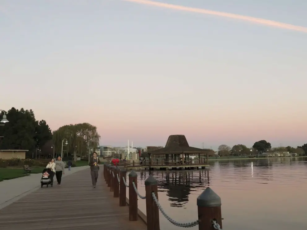 Walking along the wooden boardwalk at sunset. 