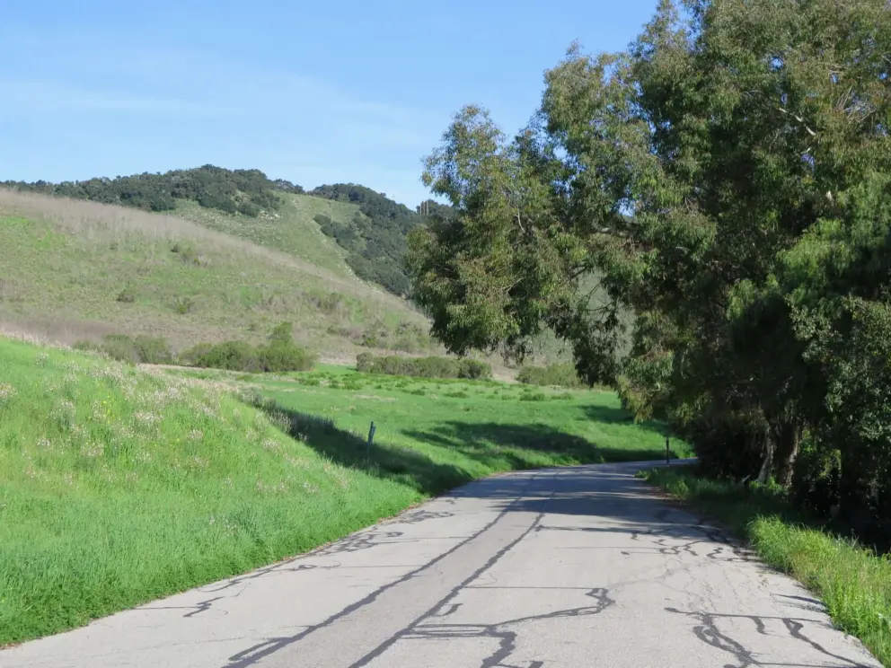 The wide road goes through a hilly landscape as it reaches Avila. 