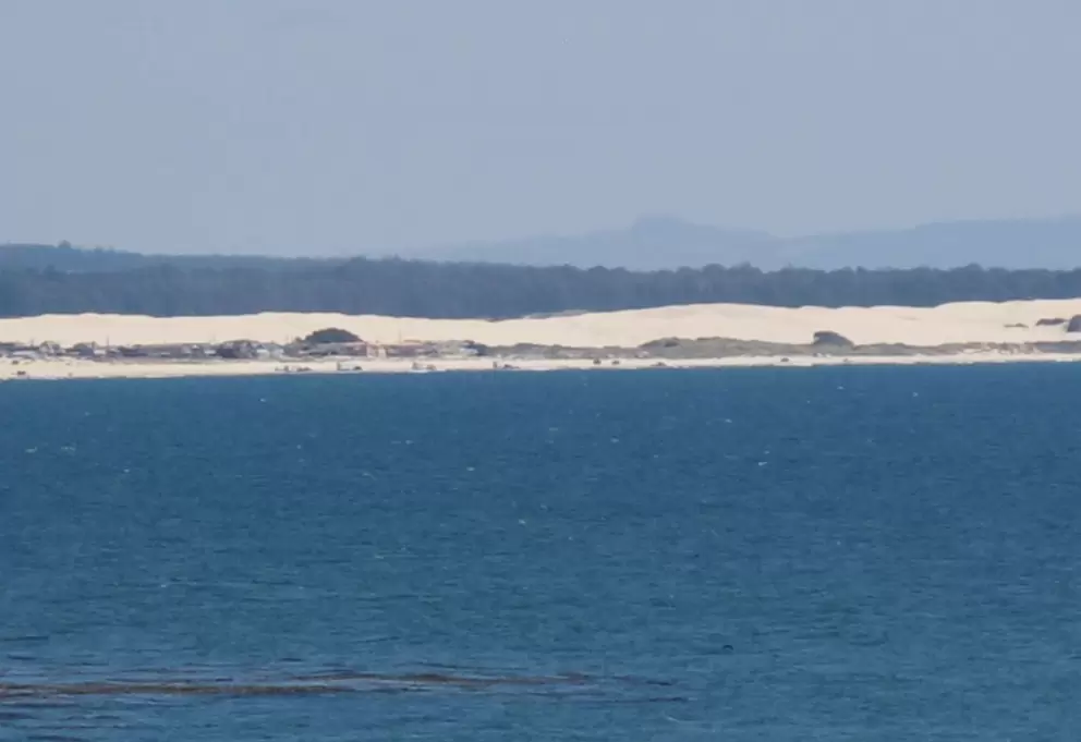 The dunes, far in the distance.