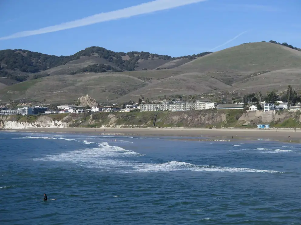Lone surfer. On the left, see the rock that juts out beside the freeway. 