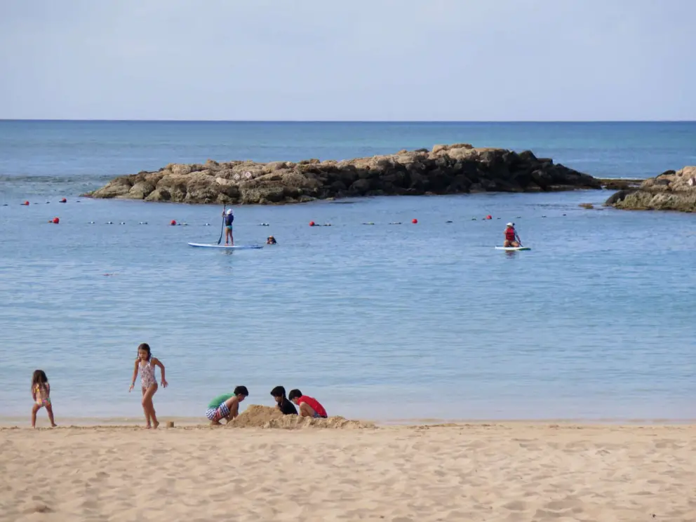 Kids playing in the sand. 