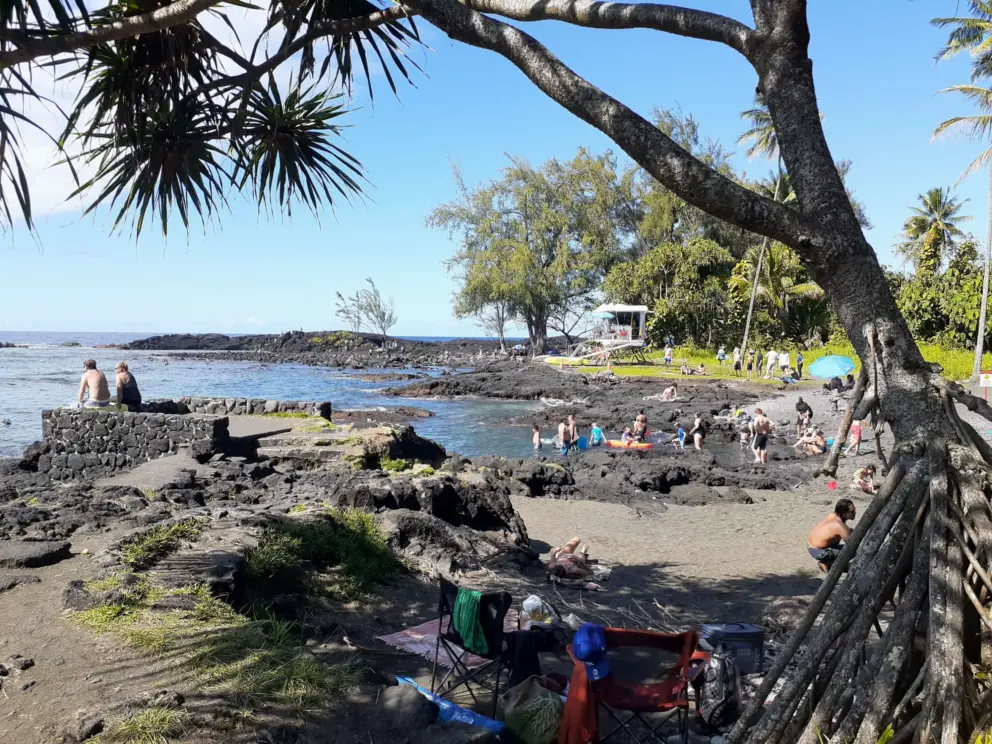 A shady spot on the black sand. 
