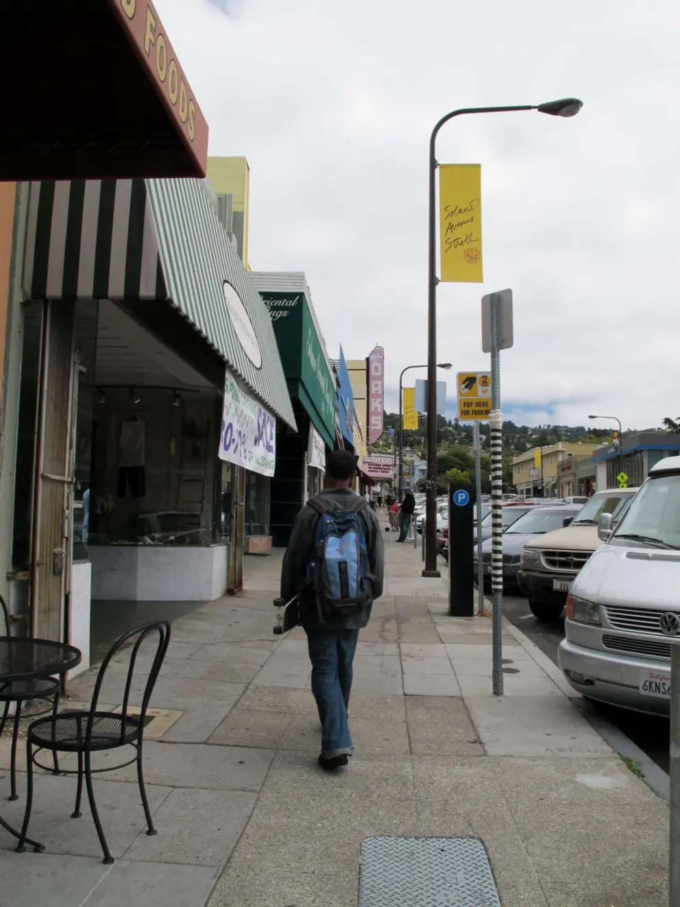 A student cruising up Solano Avenue.