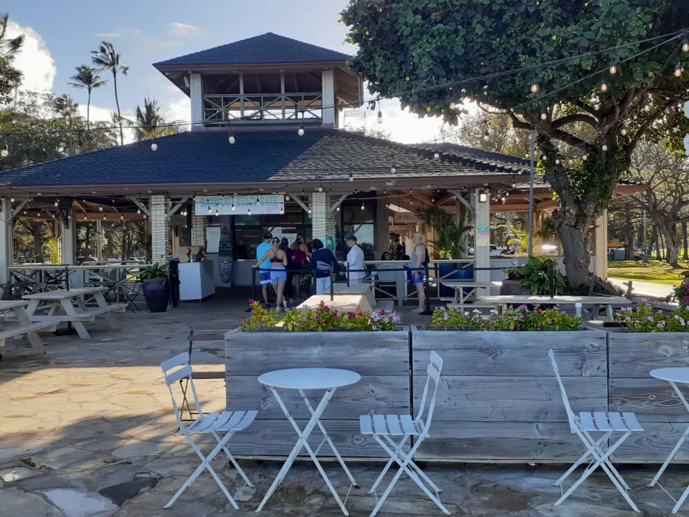 Barefoot Beach Cafe with strung lights and ocean views. 