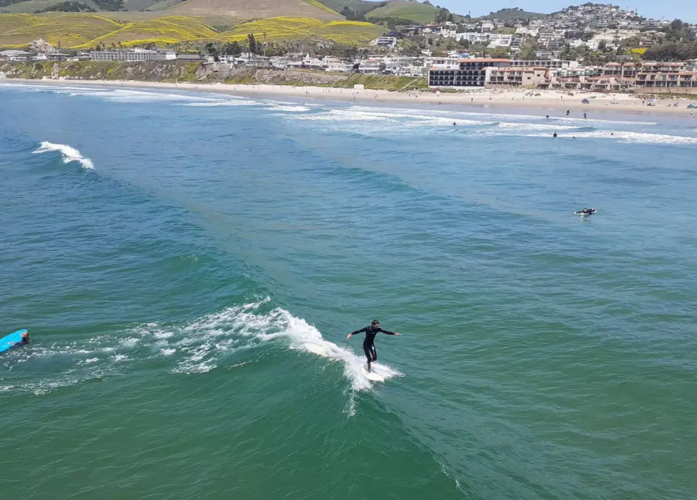 Walking to the front of the board! It's fun to see the surfers do tricks up close from the pier. 