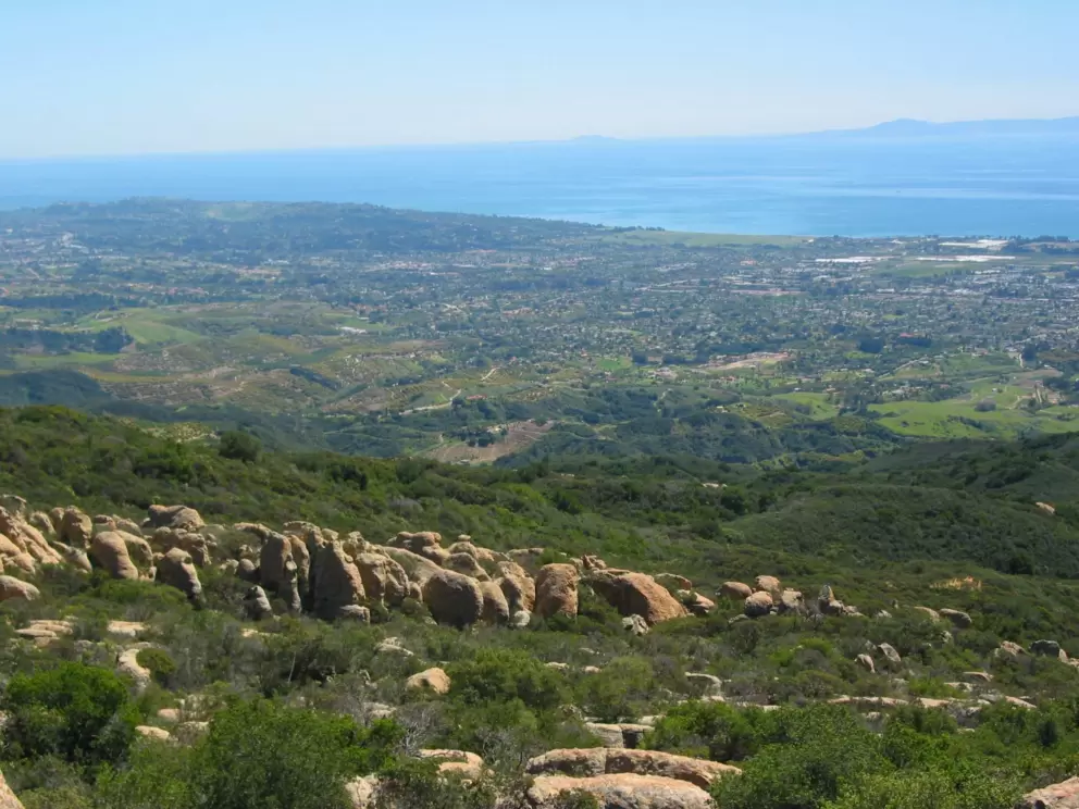 Scattered boulders and birds eye view of Santa Barbara at Playgrounds.