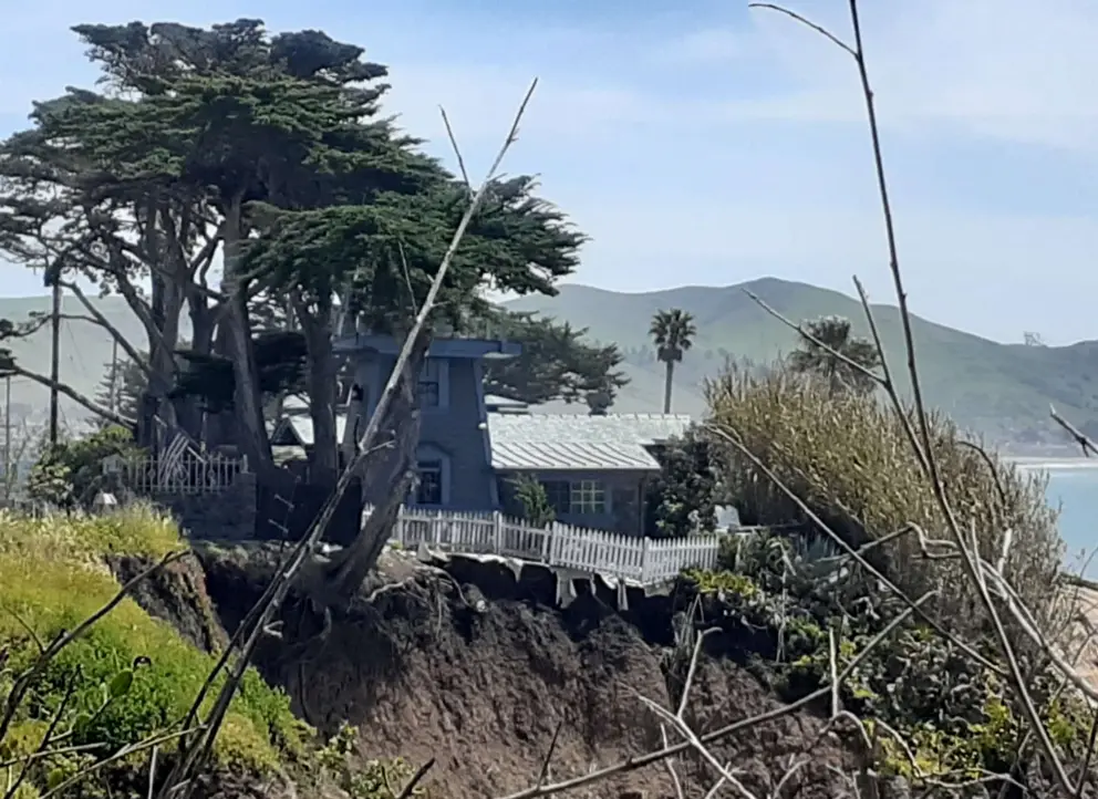 A house falling off the cliff. It is hard for these residents. 