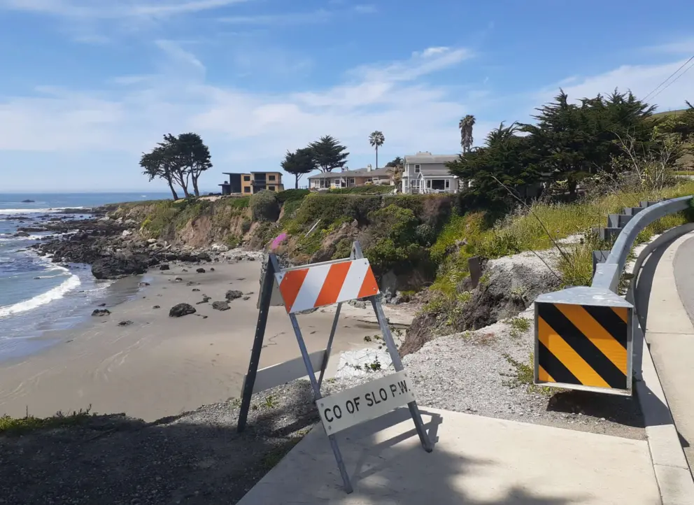 Sign warning of the path by erosion. 