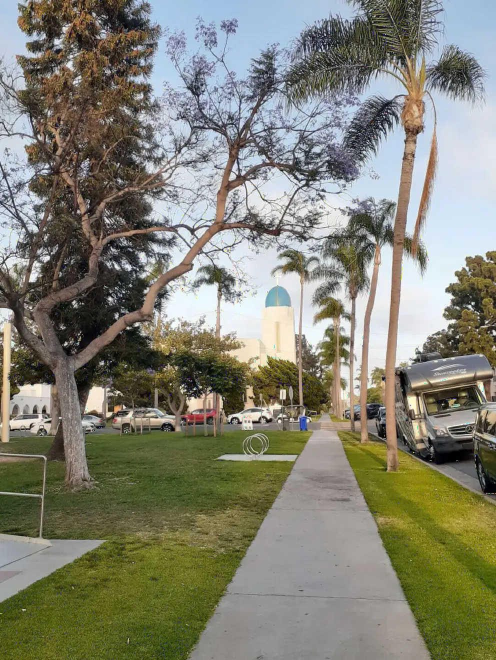 The sidewalk, with blue dome in the distance. 