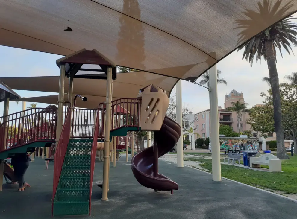 Playground and pretty building in the distance. 
