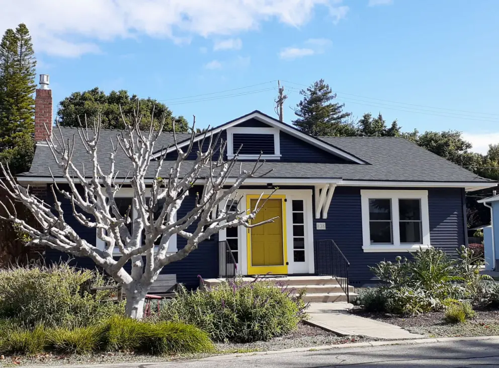 Blue house with yellow door. 