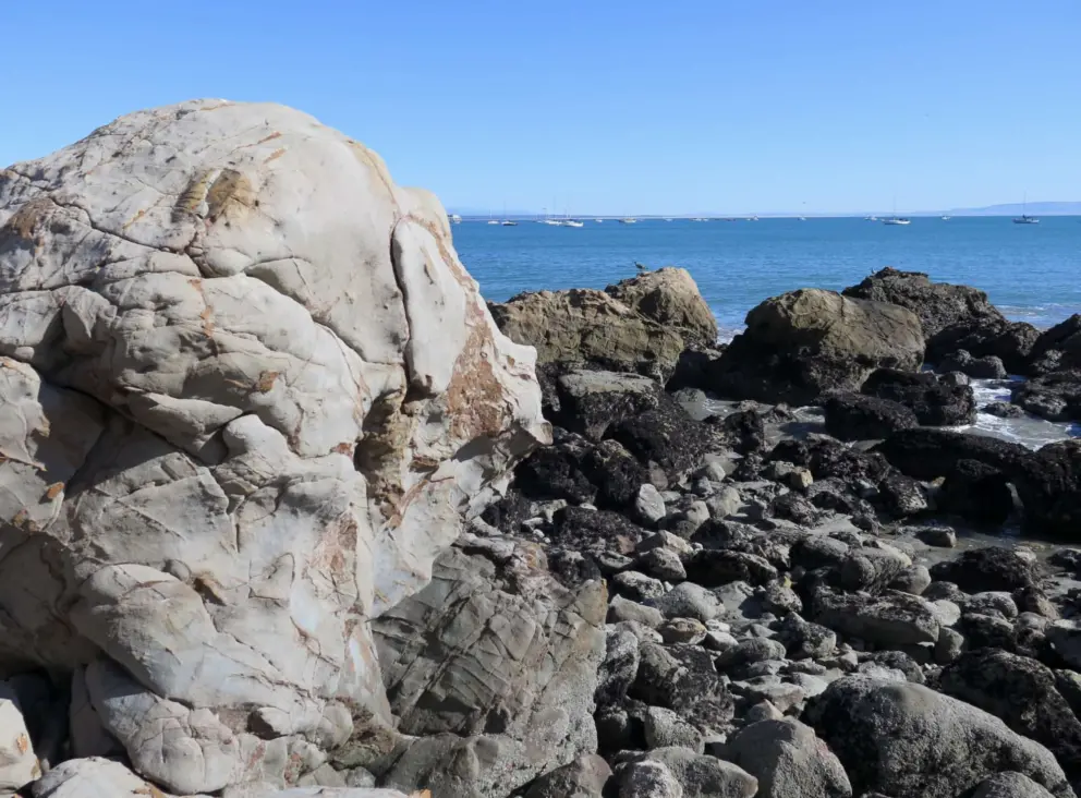 Boulder and rocks at the point that divides this beach from Olde Port Beach. 