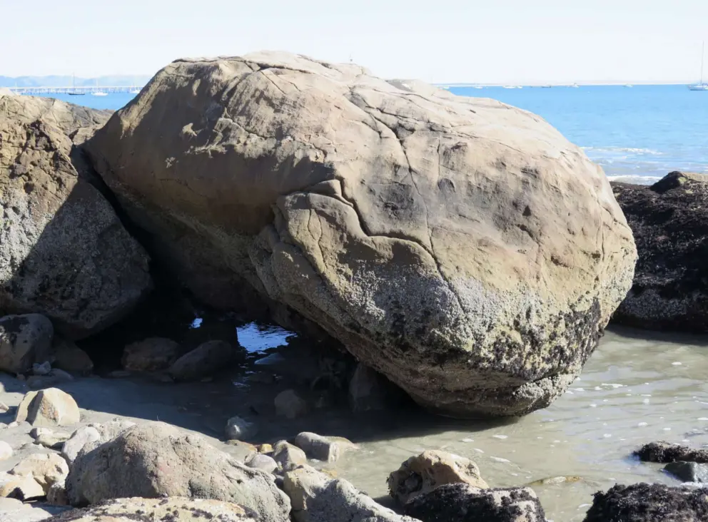 Watching the water swirl around the boulders. 