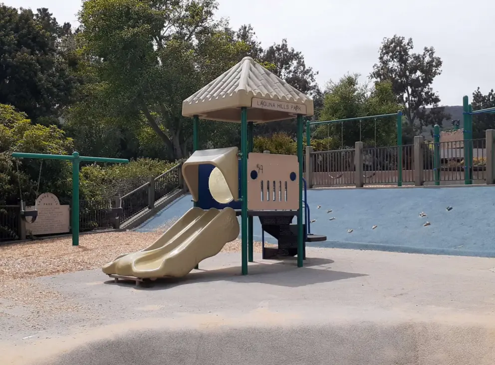 The toddler playground, baby swings, and blue wall to climb. 