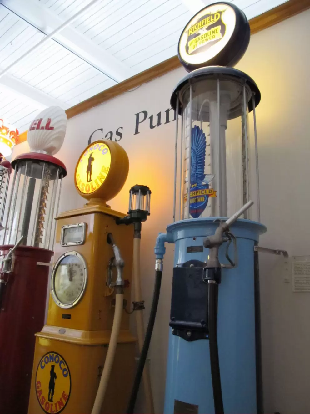 Gas pumps: Shell, Conoco, Richfield.