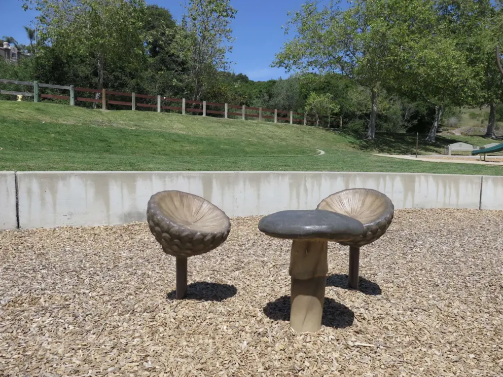 Mushroom seats at the toddler playground. 