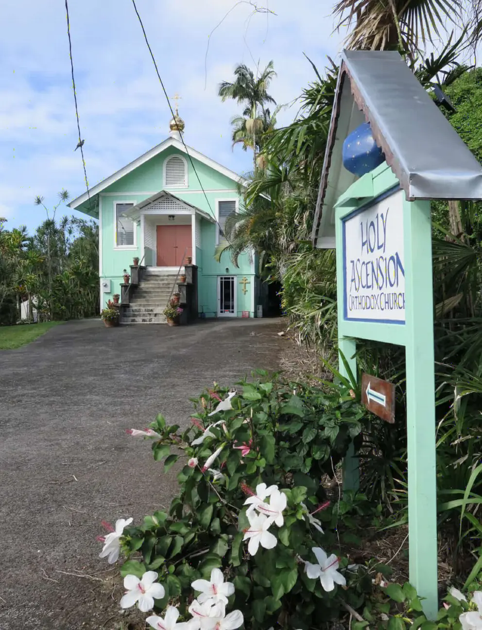 Holy Ascension Orthodox Church with its hibiscus flowers and cute architecture. 