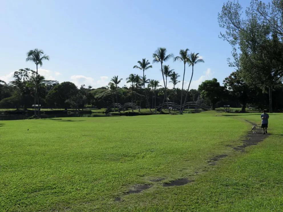 The narrow path that leads to the bridges to the main side of Wailoa River State Park. 