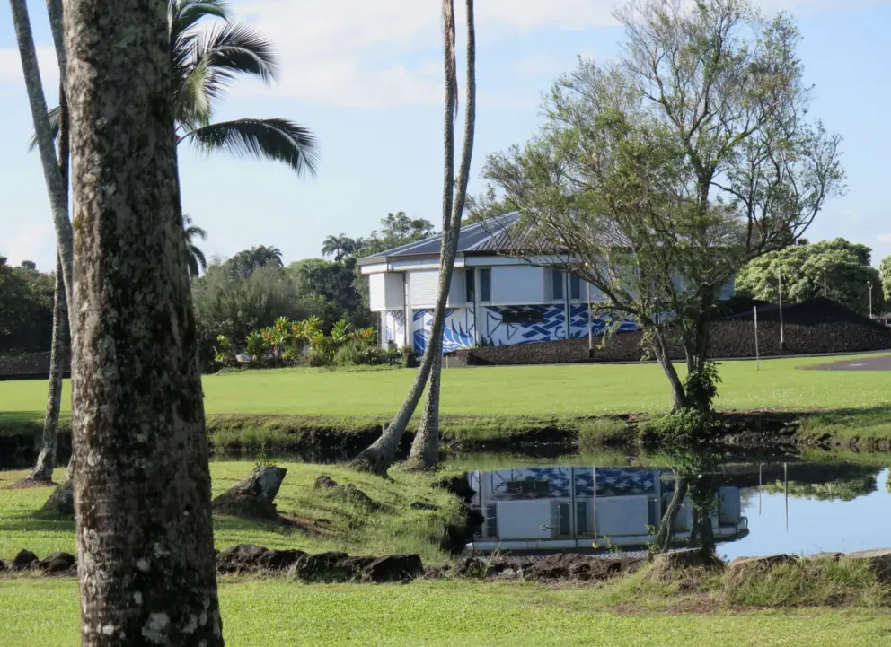 The Wailoa Art Center, as seen from across the water, by the statue. 