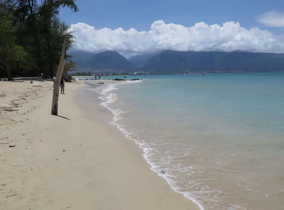 The shoreline with mysterious mountains in the distance. 