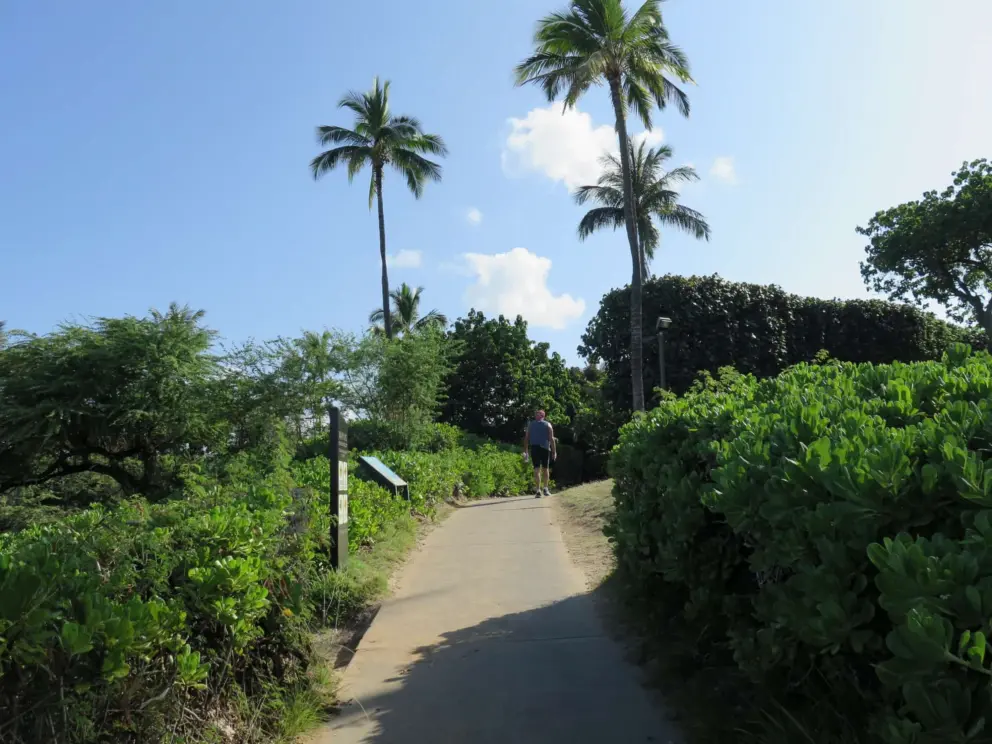 A couple heads north on the path from the public parking lot at Wailea Beach.